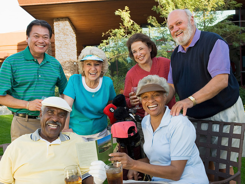 Group of people posing for a picture smiling